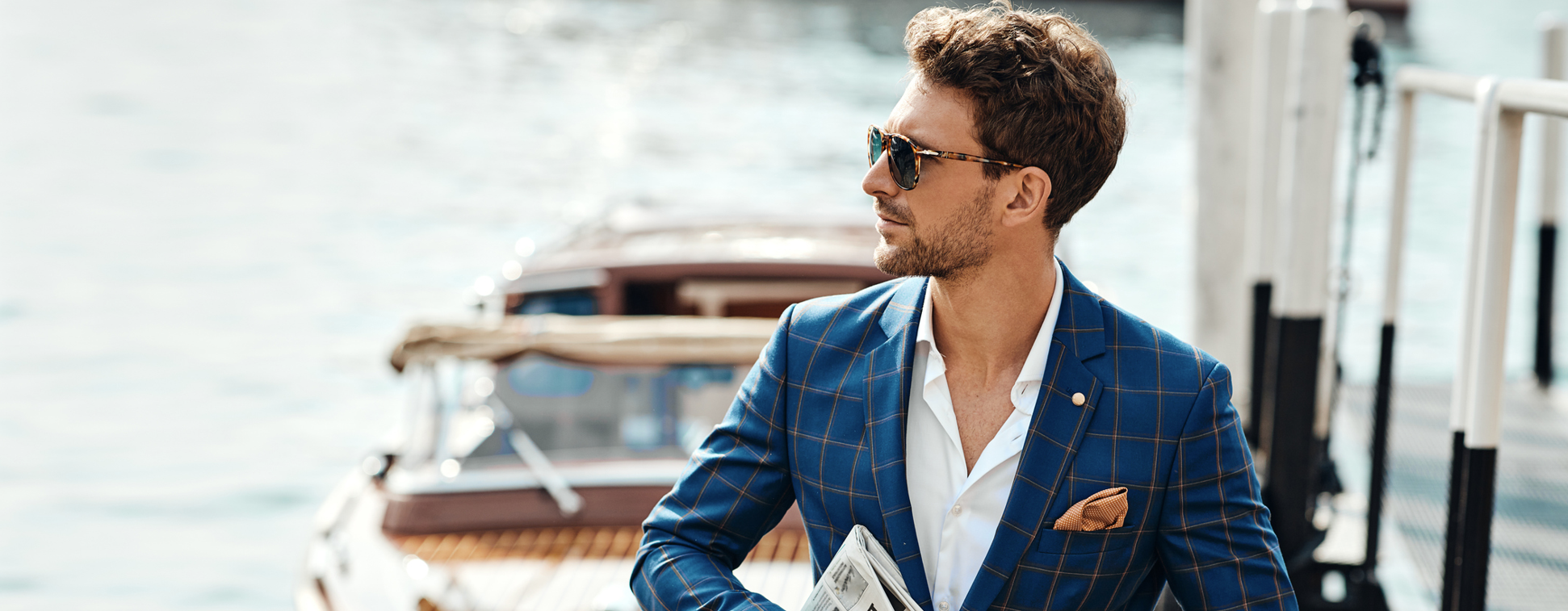 A man seated at a marina